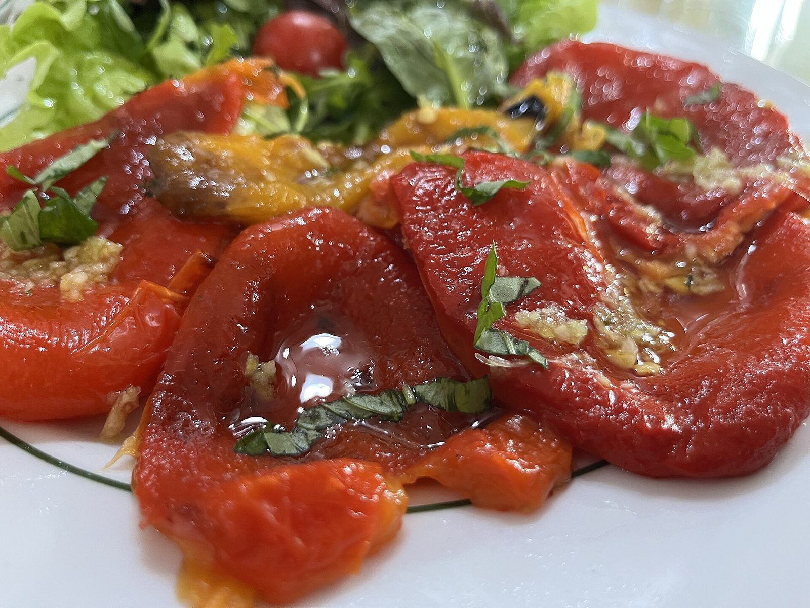 Grilled red peppers dressed with olive oil, garlic and basil